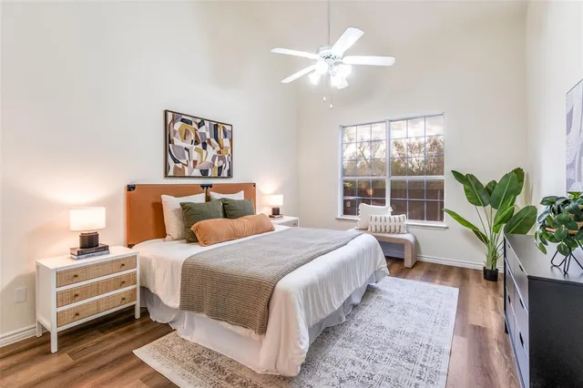 a bedroom with bed and a window