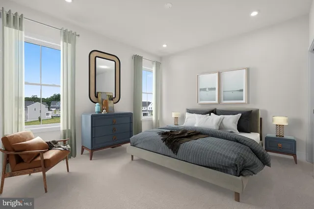 a spacious bedroom with a bed and wooden floor