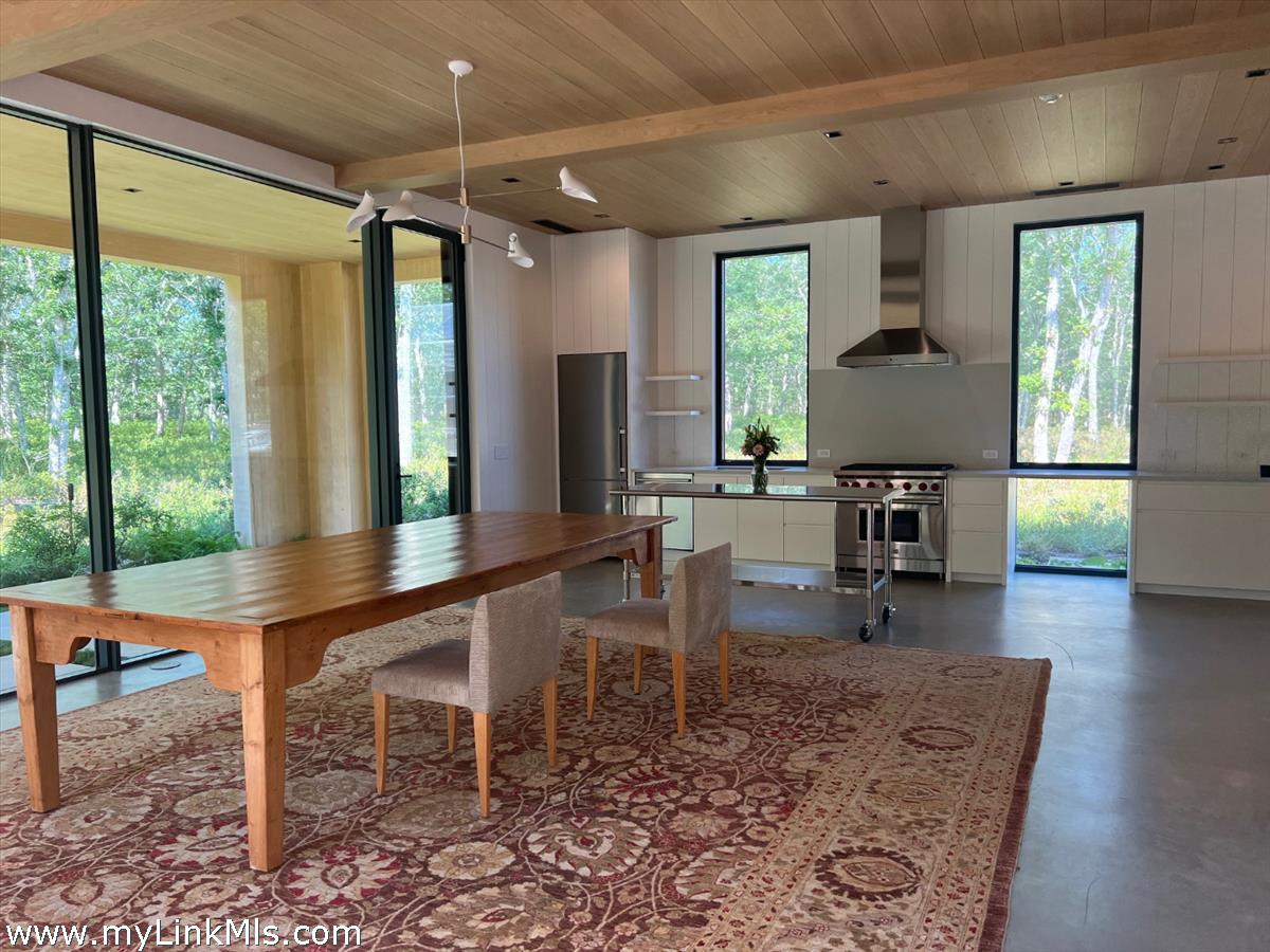 4 Jacob's Neck Road Edgartown, MA 02539 - Photo 10 of 20 a room with lots of furniture and windows
