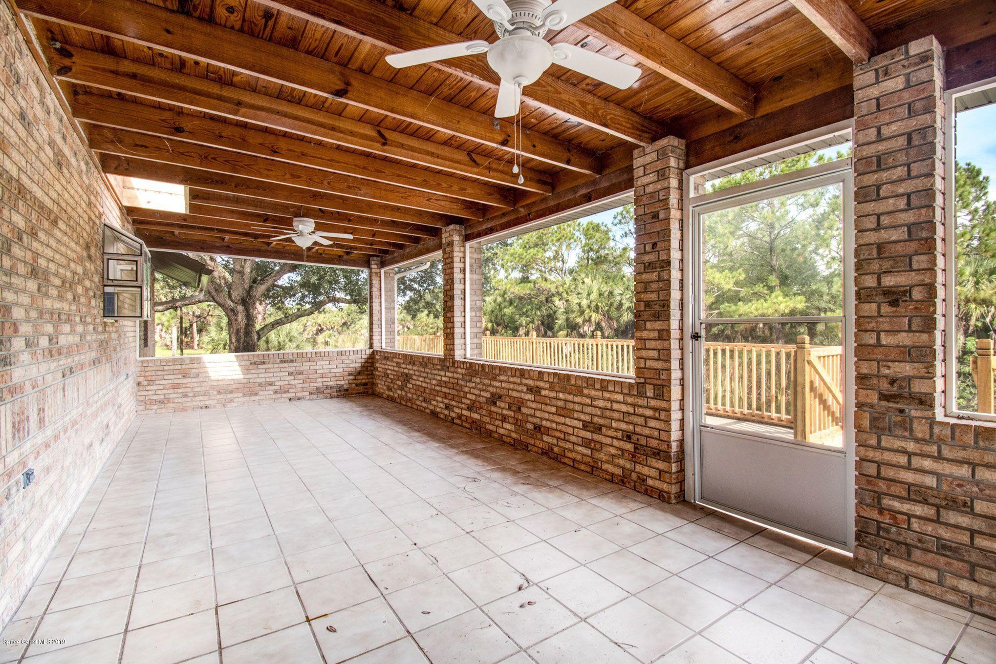 5130 Evinrude Road Melbourne, FL 32934 - Photo 21 of 36 Expansive Screened In Porch