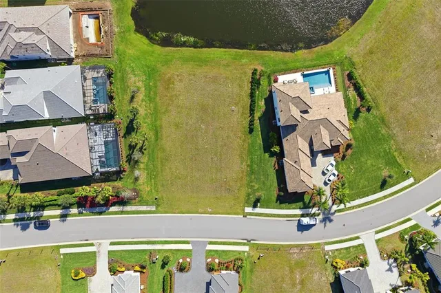 an aerial view of a house with a swimming pool