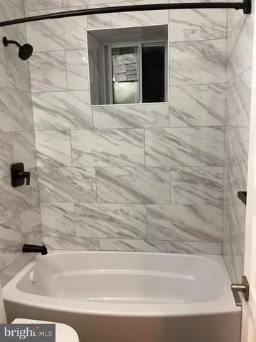 a bathroom with a bathtub