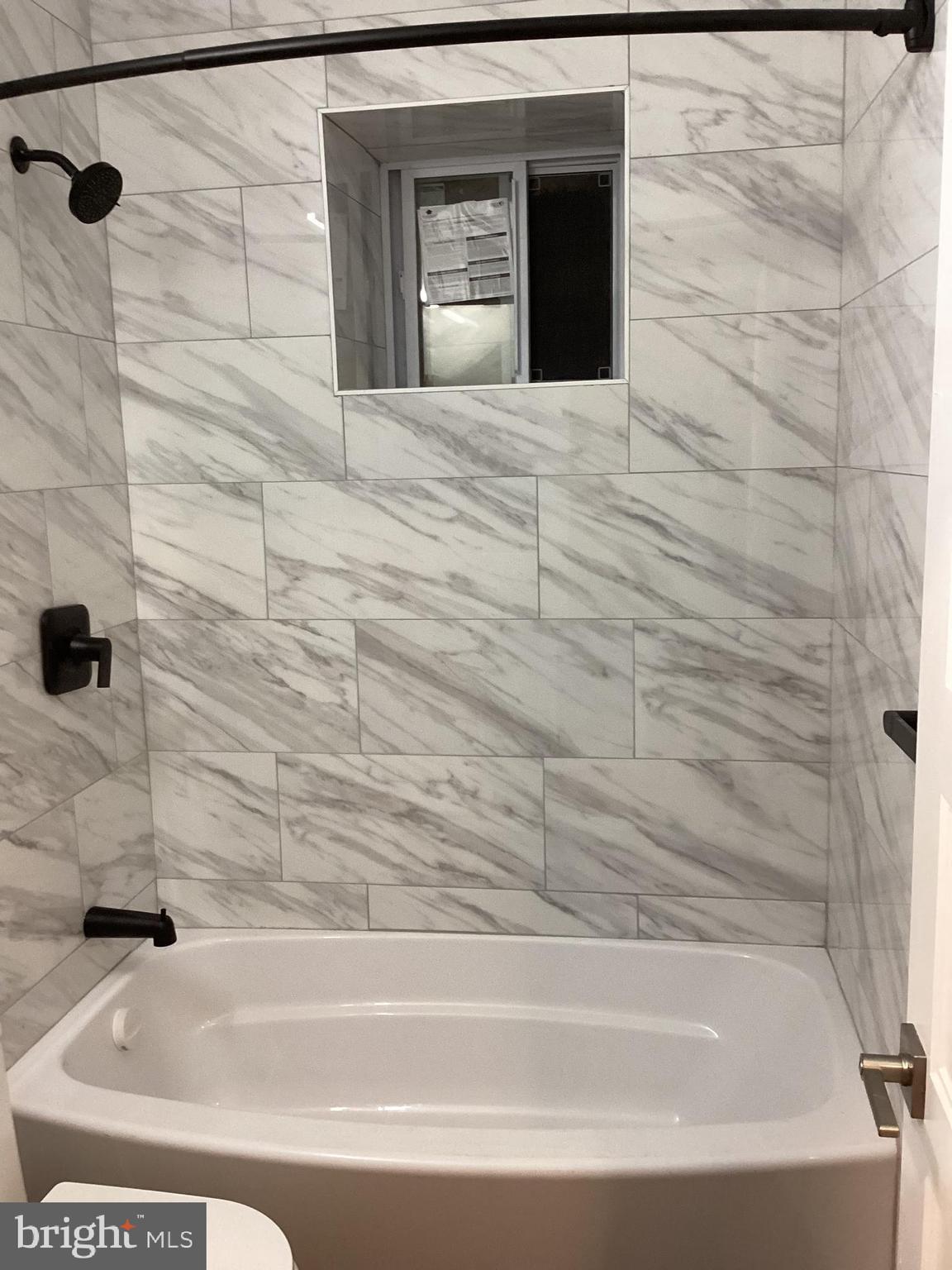 221 Slocum Street Philadelphia, PA 19119 - Photo 13 of 17 a bathroom with a bathtub