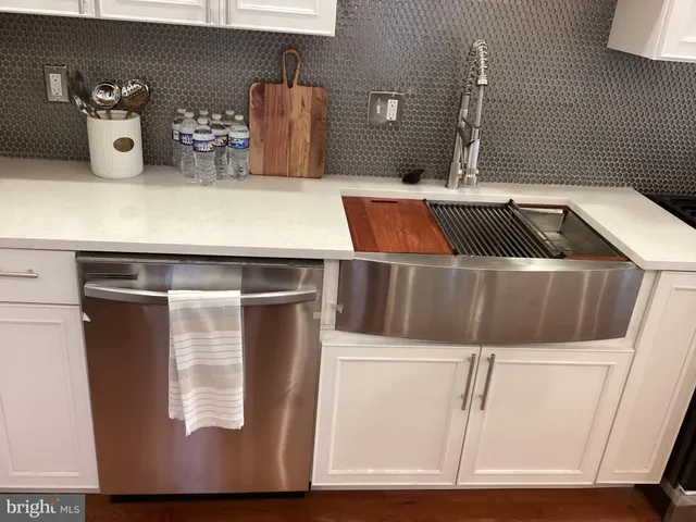 a bathroom with a sink and mirror