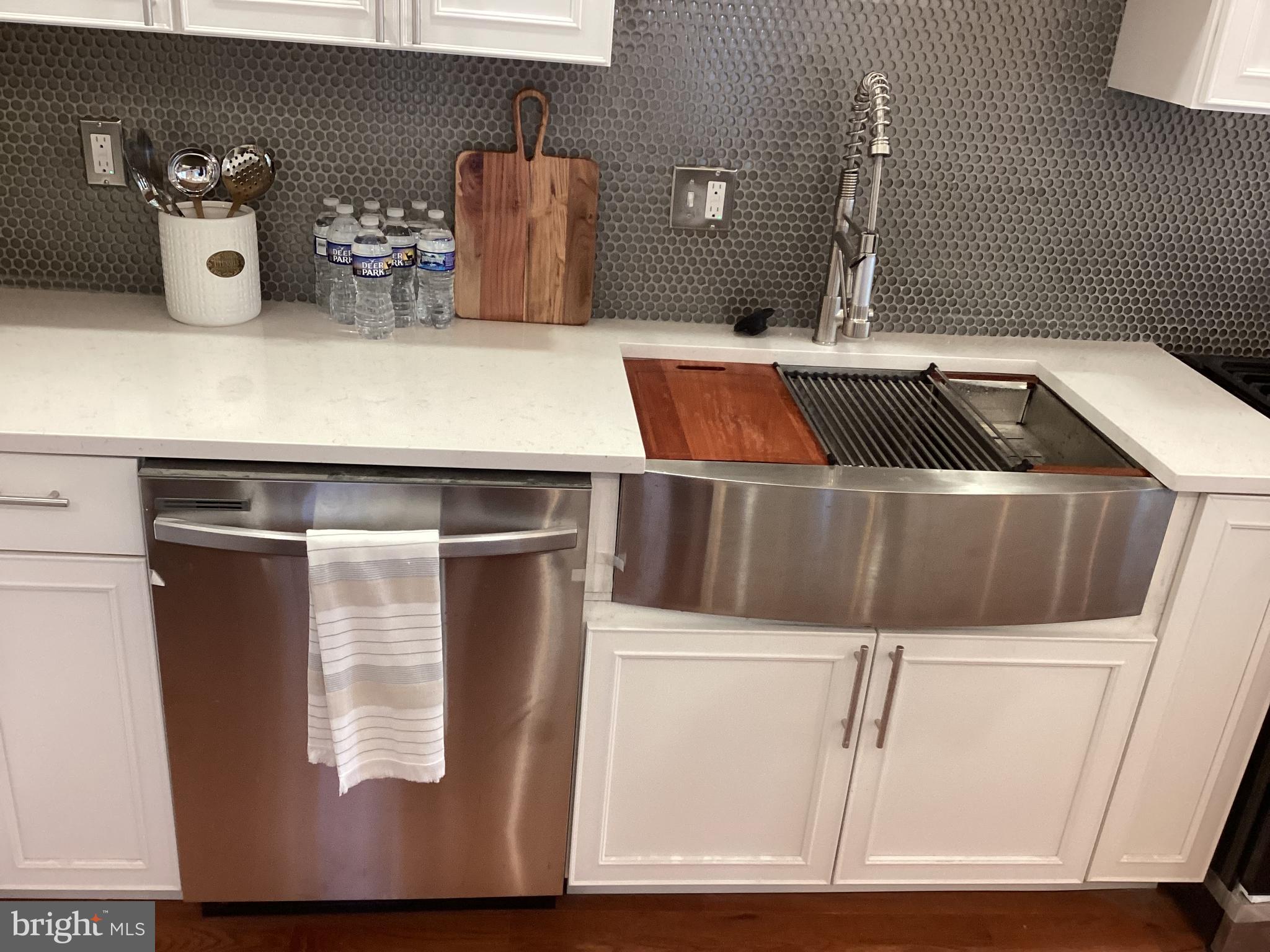 221 Slocum Street Philadelphia, PA 19119 - Photo 2 of 17 a bathroom with a sink and mirror