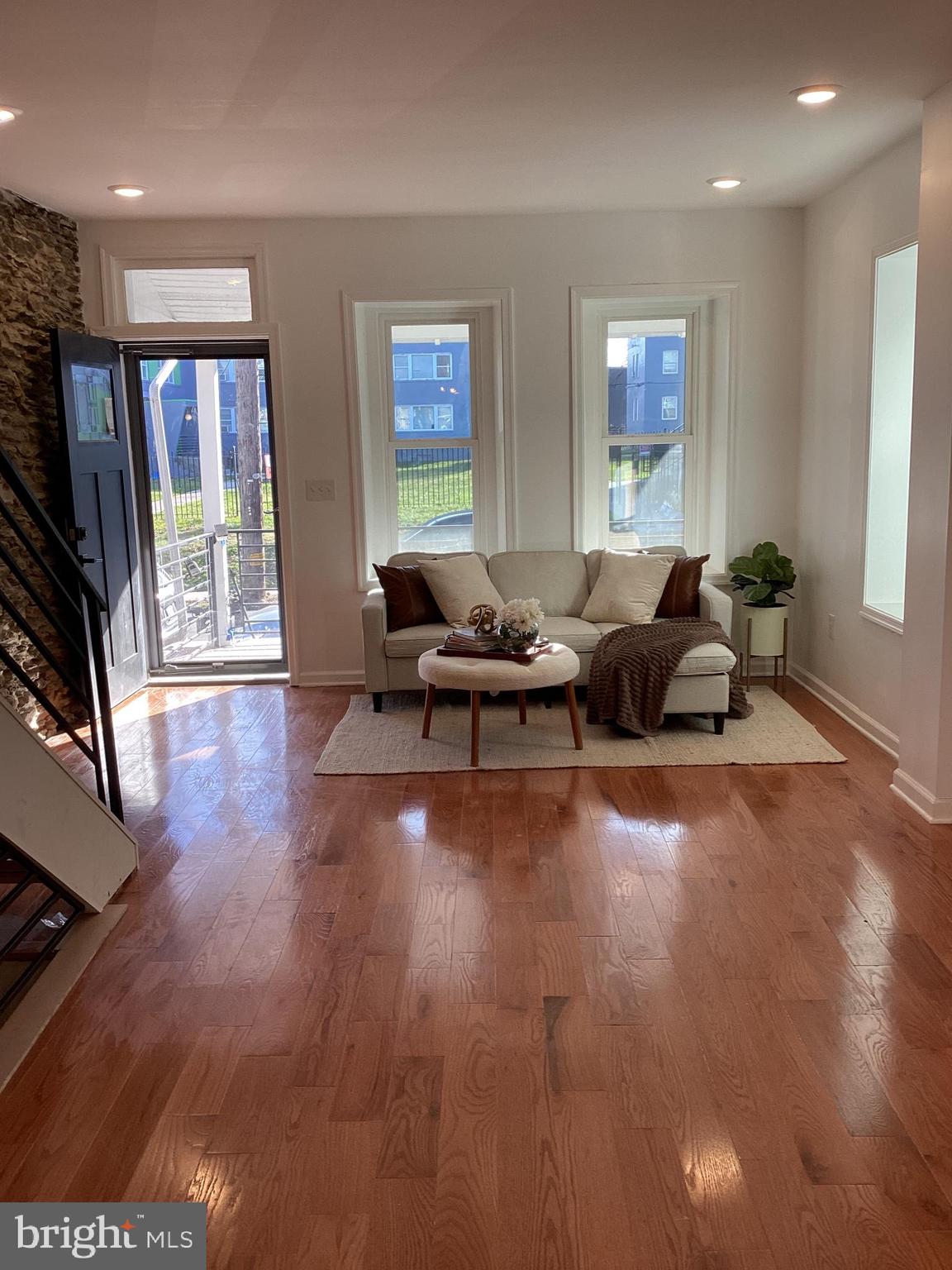 221 Slocum Street Philadelphia, PA 19119 - Photo 6 of 17 a living room with furniture window and wooden floor