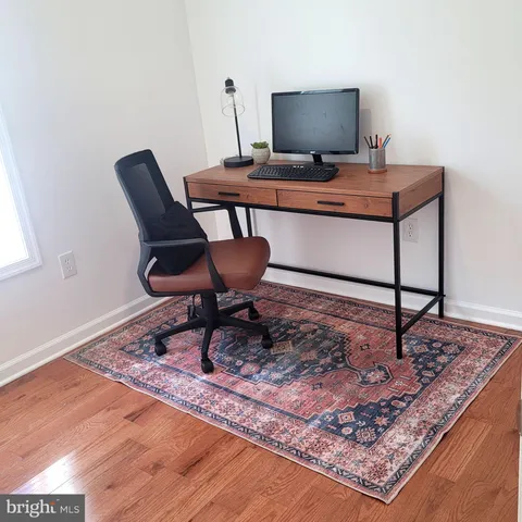 a living room with a rug