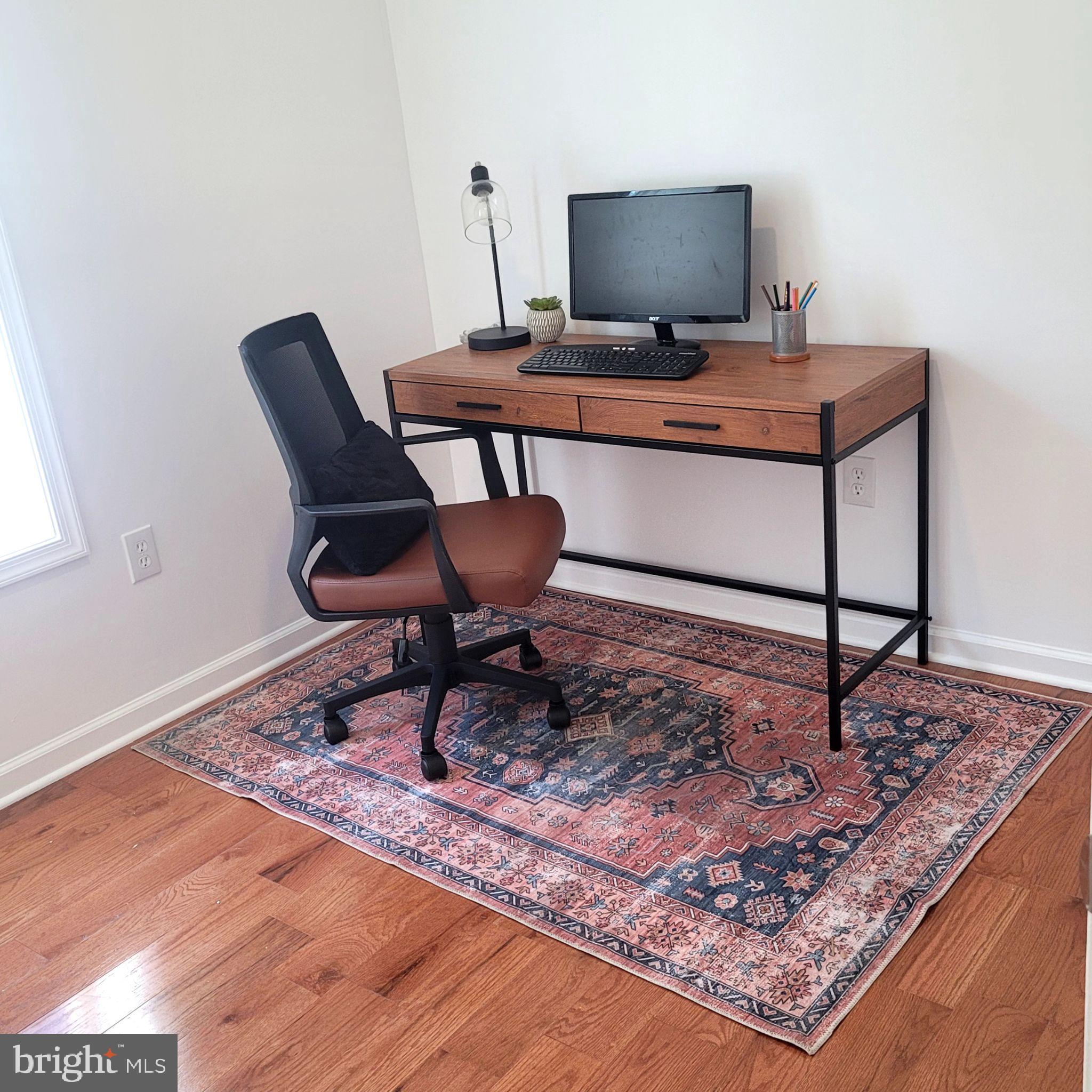 221 Slocum Street Philadelphia, PA 19119 - Photo 8 of 17 a living room with a rug