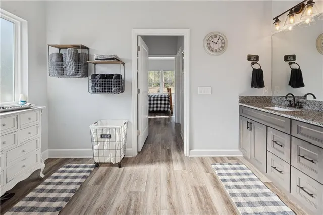 a hallway with a sink and a window