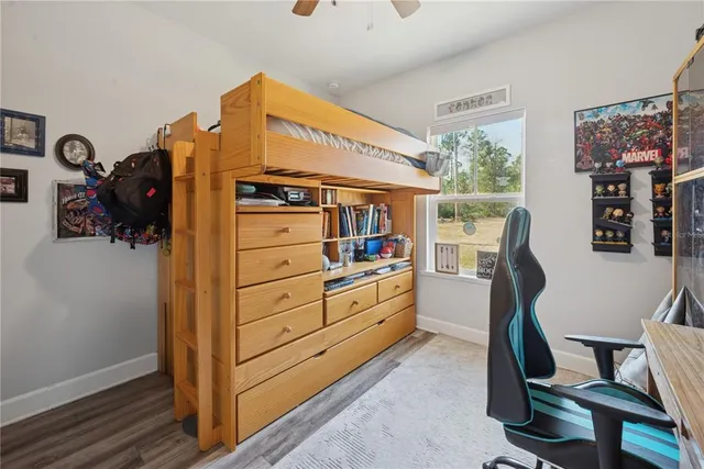 a kitchen with a refrigerator and a desk