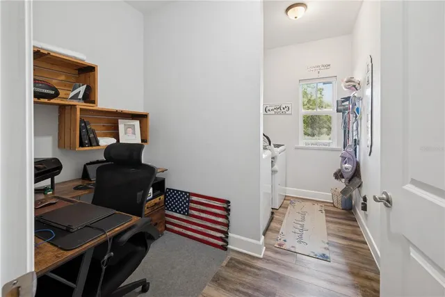 a view of a big yard with large trees