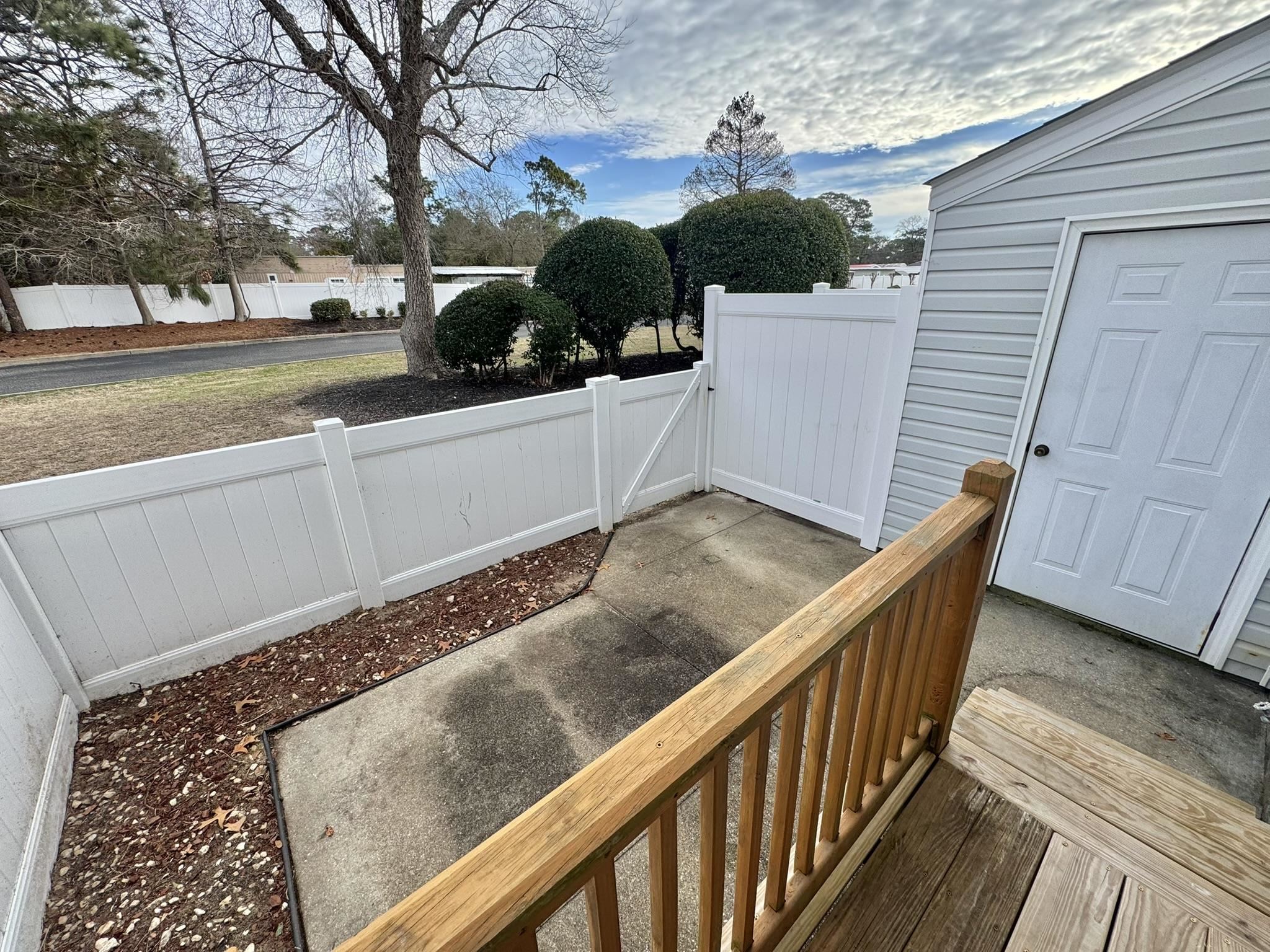 4115 Little River Road, Unit 10B Myrtle Beach, SC 29577 - Photo 16 of 31 Wooden deck featuring a gate