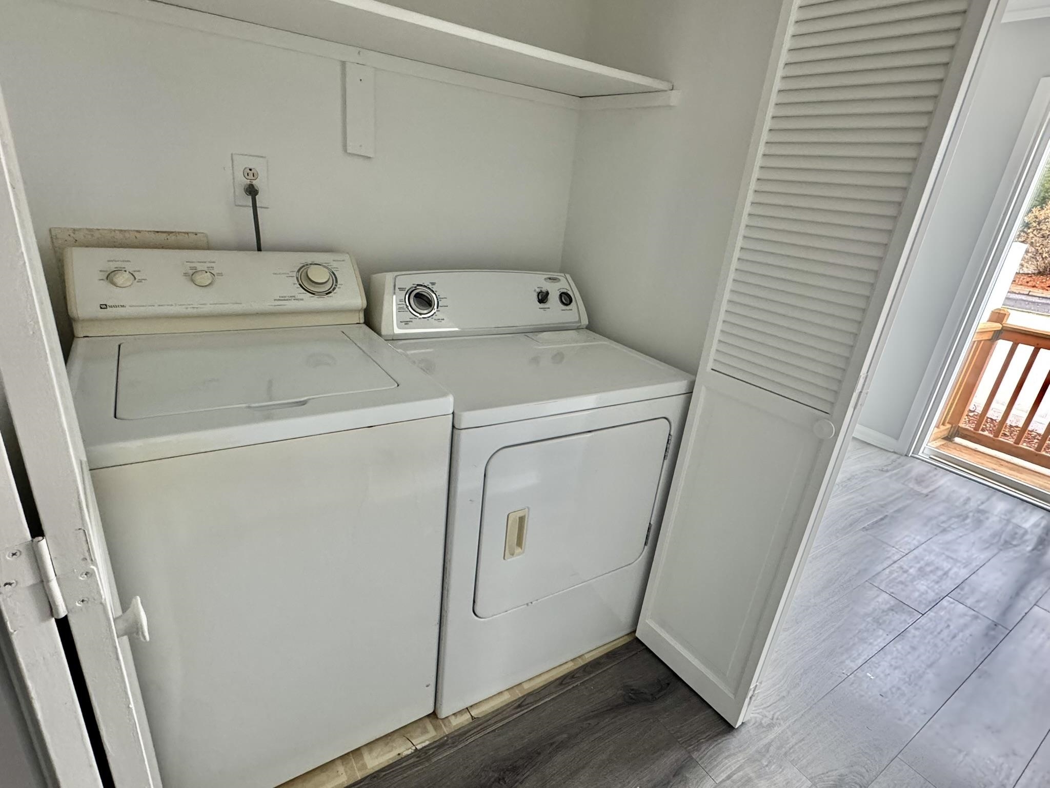 4115 Little River Road, Unit 10B Myrtle Beach, SC 29577 - Photo 6 of 31 Washroom featuring dark wood-style flooring and washing machine and clothes dryer