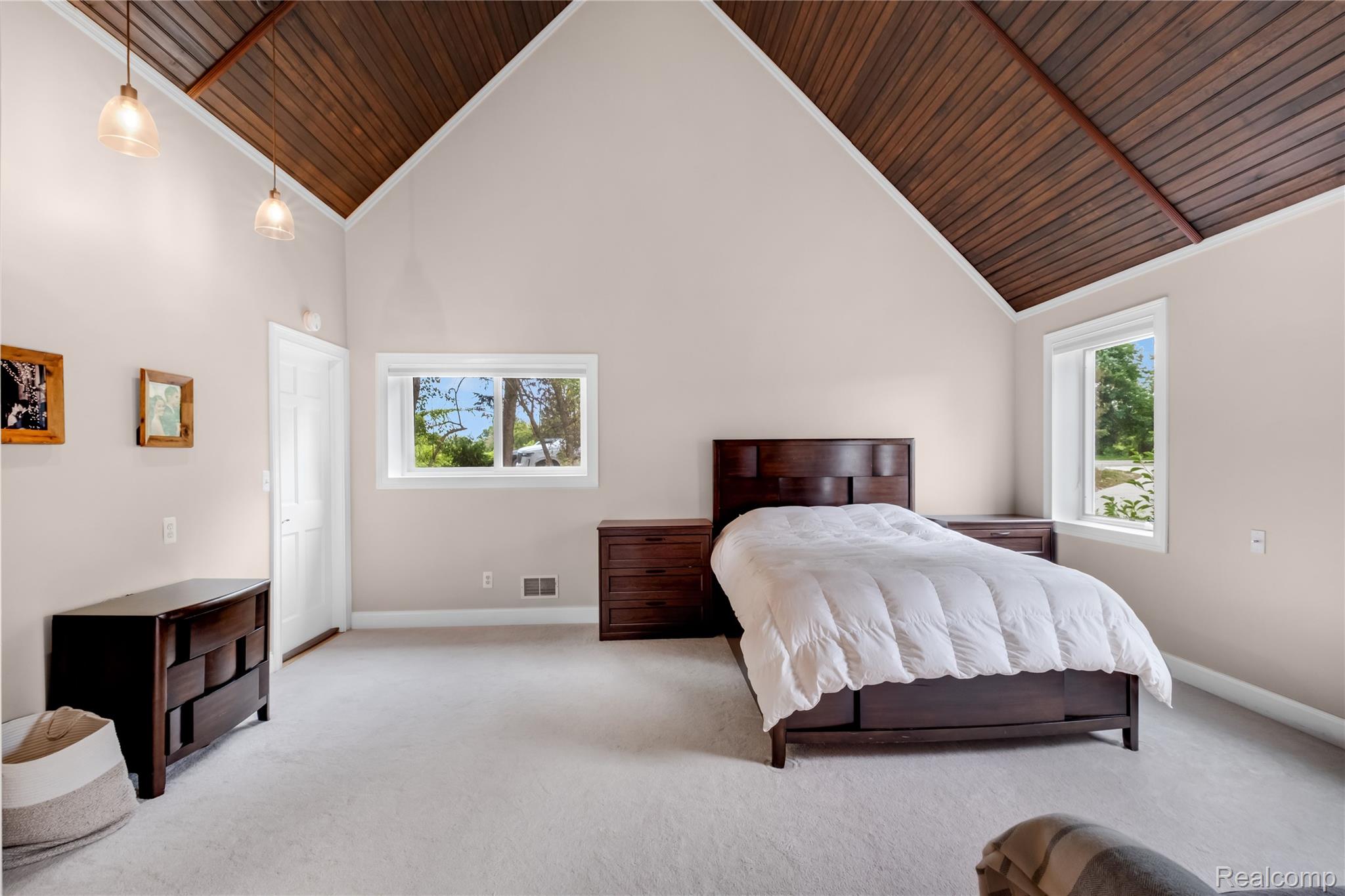 15420 Jennings Road Fenton, MI 48430 - Photo 18 of 45 Vaulted wood-finish ceiling, neutral wall paint, and light-colored carpeting