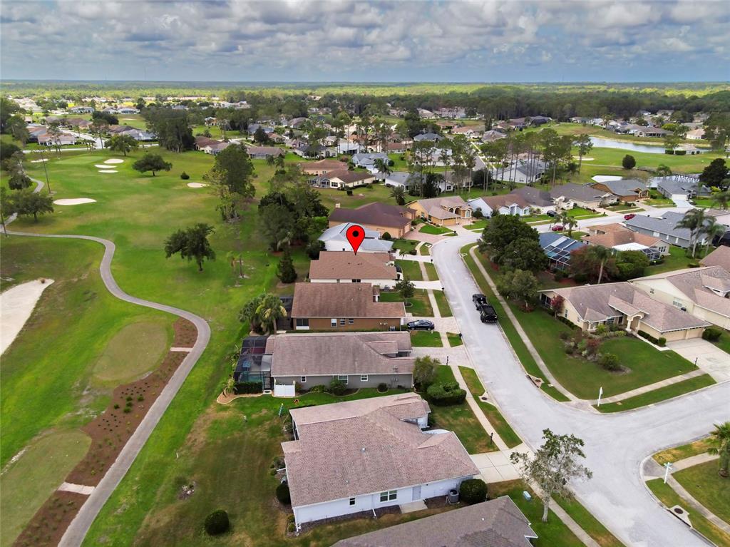 11228 Windrush Circle Hudson, FL 34667 - Photo 50 of 67 an aerial view of residential houses with outdoor space