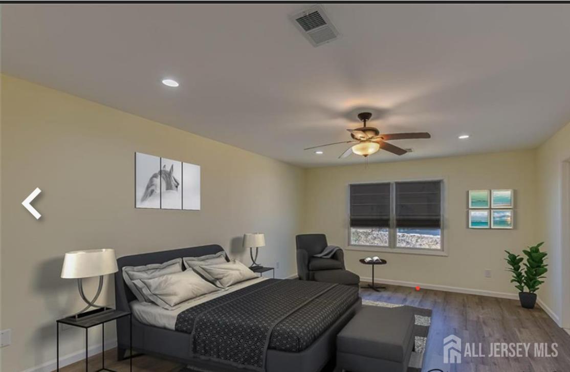 a living room with furniture a chandelier and a window