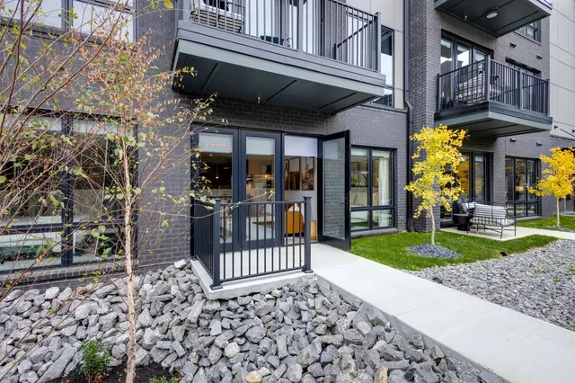 an aerial view of residential houses with city view