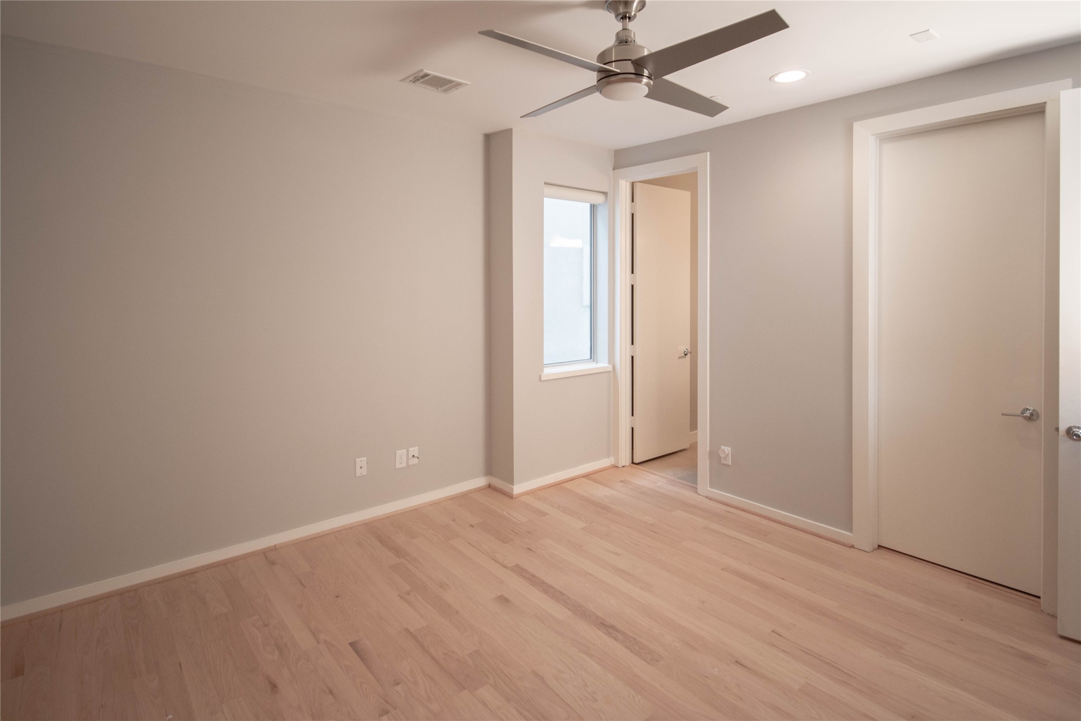 2423 West Main Street, Unit B Houston, TX 77098 - Photo 15 of 45 wooden floor in an empty room