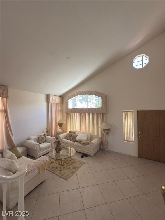 815 Rising Star Drive Henderson, NV 89014 - Photo 6 of 12 Living area featuring light tile patterned flooring and high vaulted ceiling