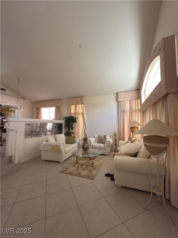 815 Rising Star Drive Henderson, NV 89014 - Photo 7 of 12 Living room featuring light tile patterned floors and high vaulted ceiling