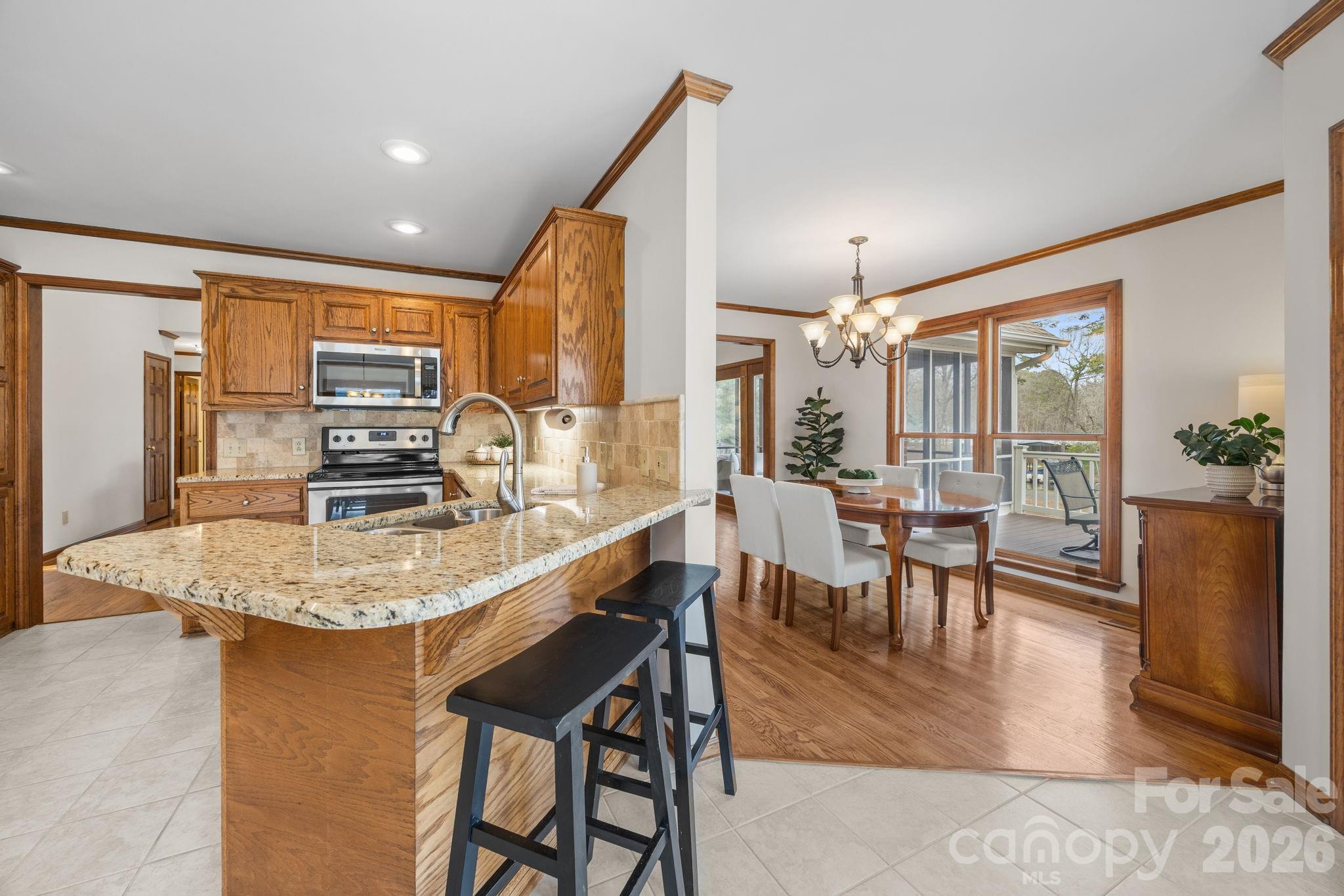 49449 River Run Road Albemarle, NC 28001 - Photo 14 of 45 a dining table with chairs and window