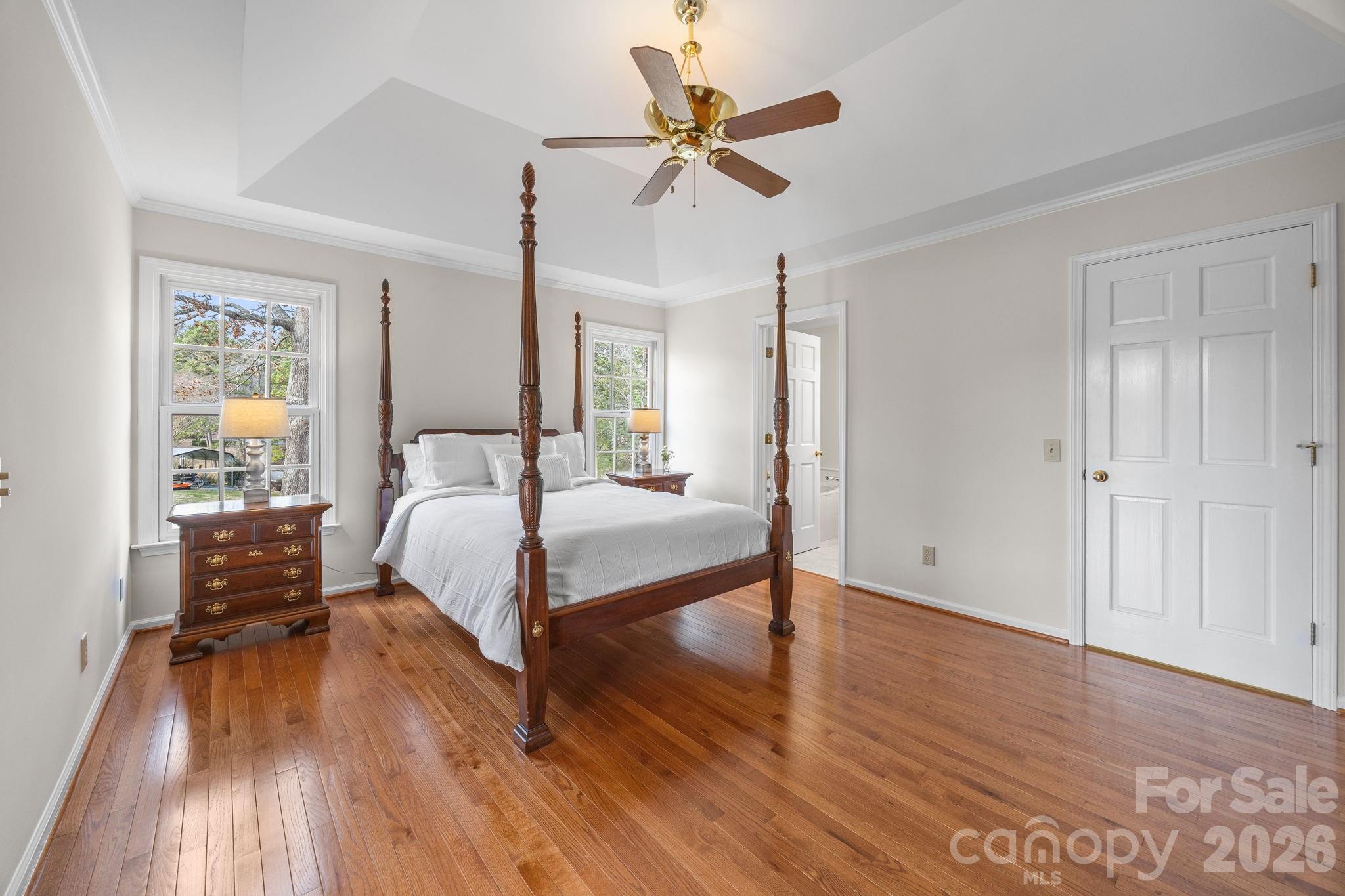 49449 River Run Road Albemarle, NC 28001 - Photo 16 of 45 a bedroom with a bed and wooden floor