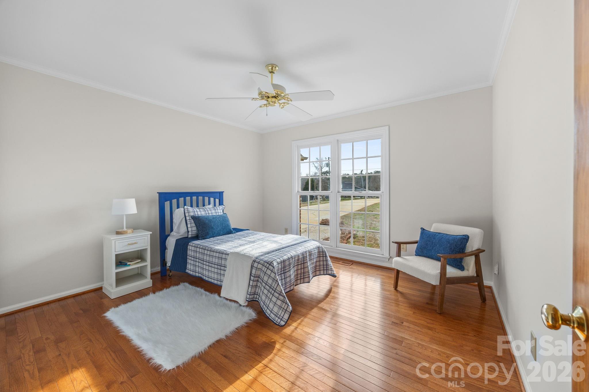49449 River Run Road Albemarle, NC 28001 - Photo 19 of 45 a bedroom with a bed and a chair