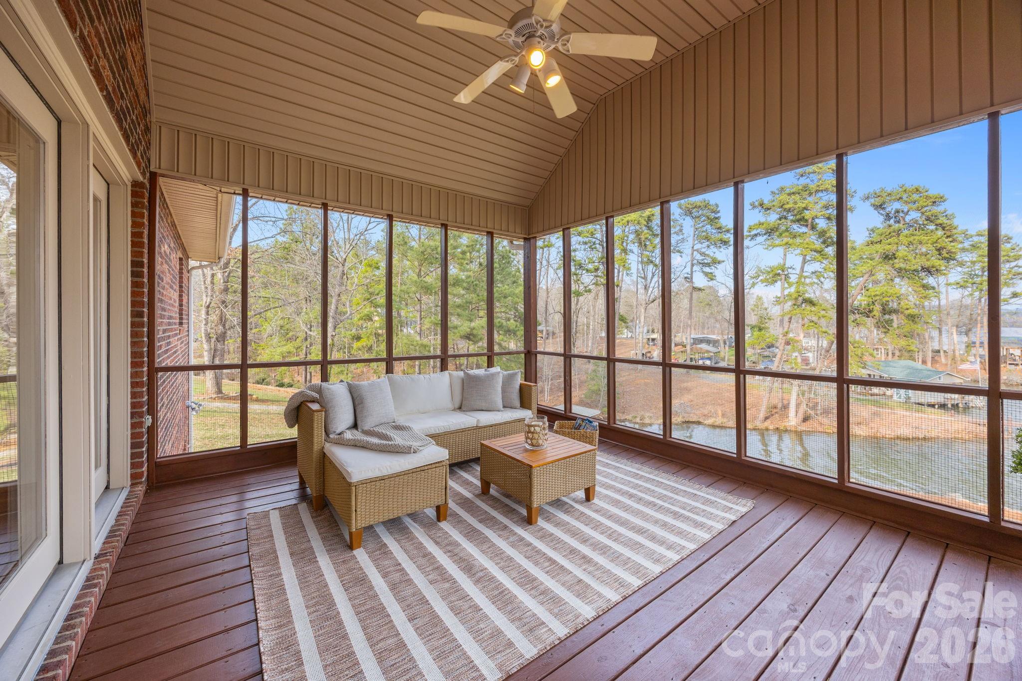49449 River Run Road Albemarle, NC 28001 - Photo 25 of 45 a living room with large windows and wooden floor