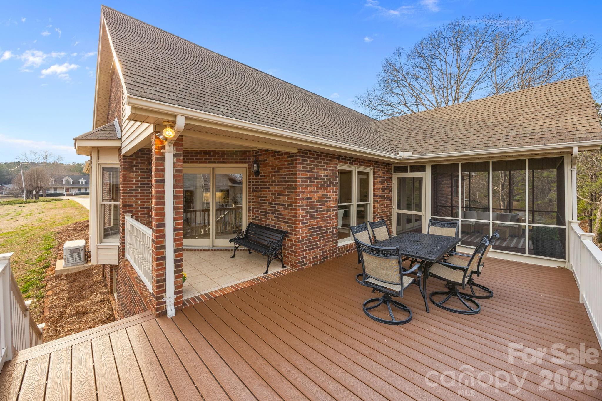 49449 River Run Road Albemarle, NC 28001 - Photo 27 of 45 a view of a patio with table and chairs and wooden floor