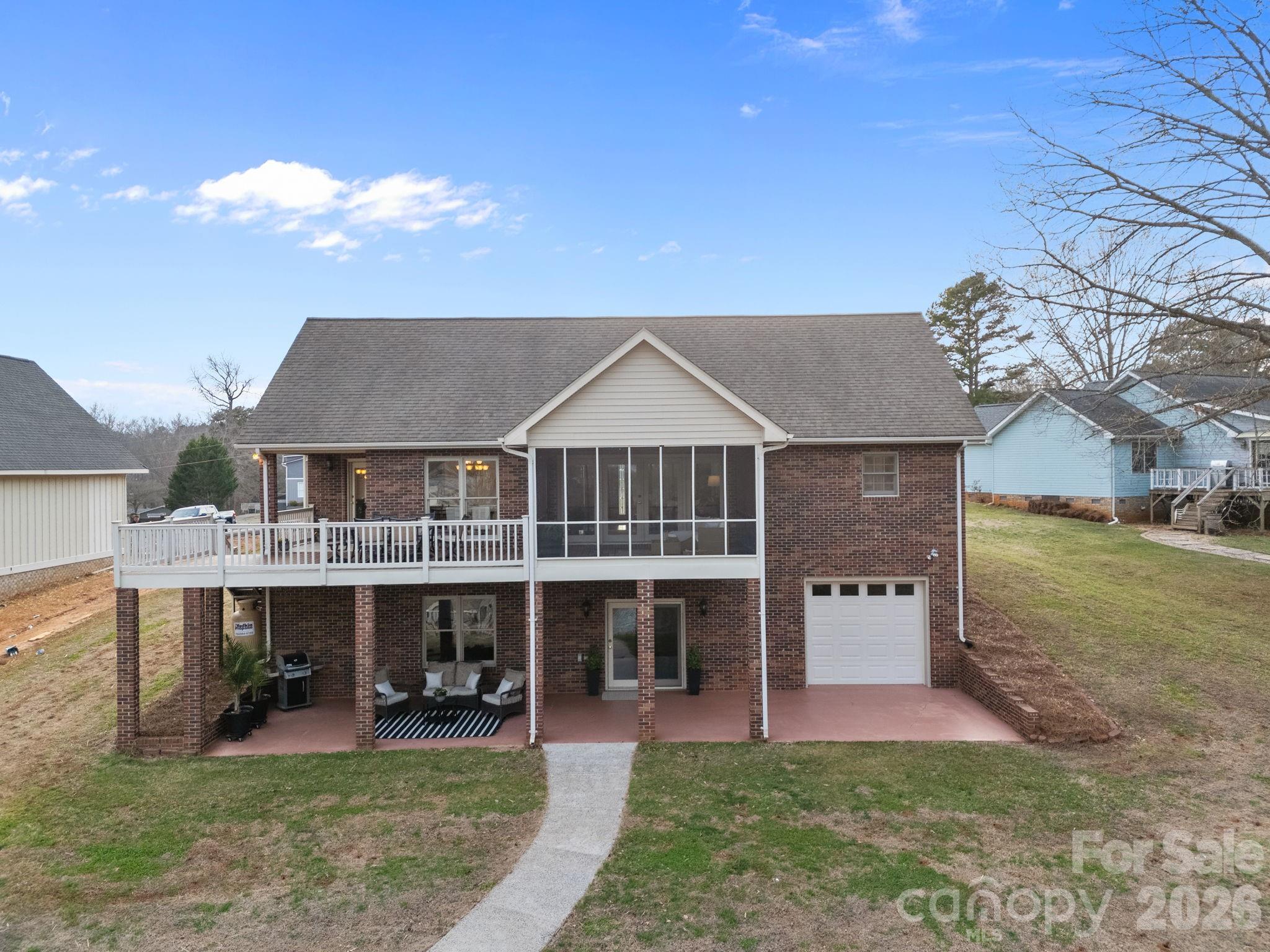 49449 River Run Road Albemarle, NC 28001 - Photo 34 of 45 a view of a house with a yard balcony and sitting area