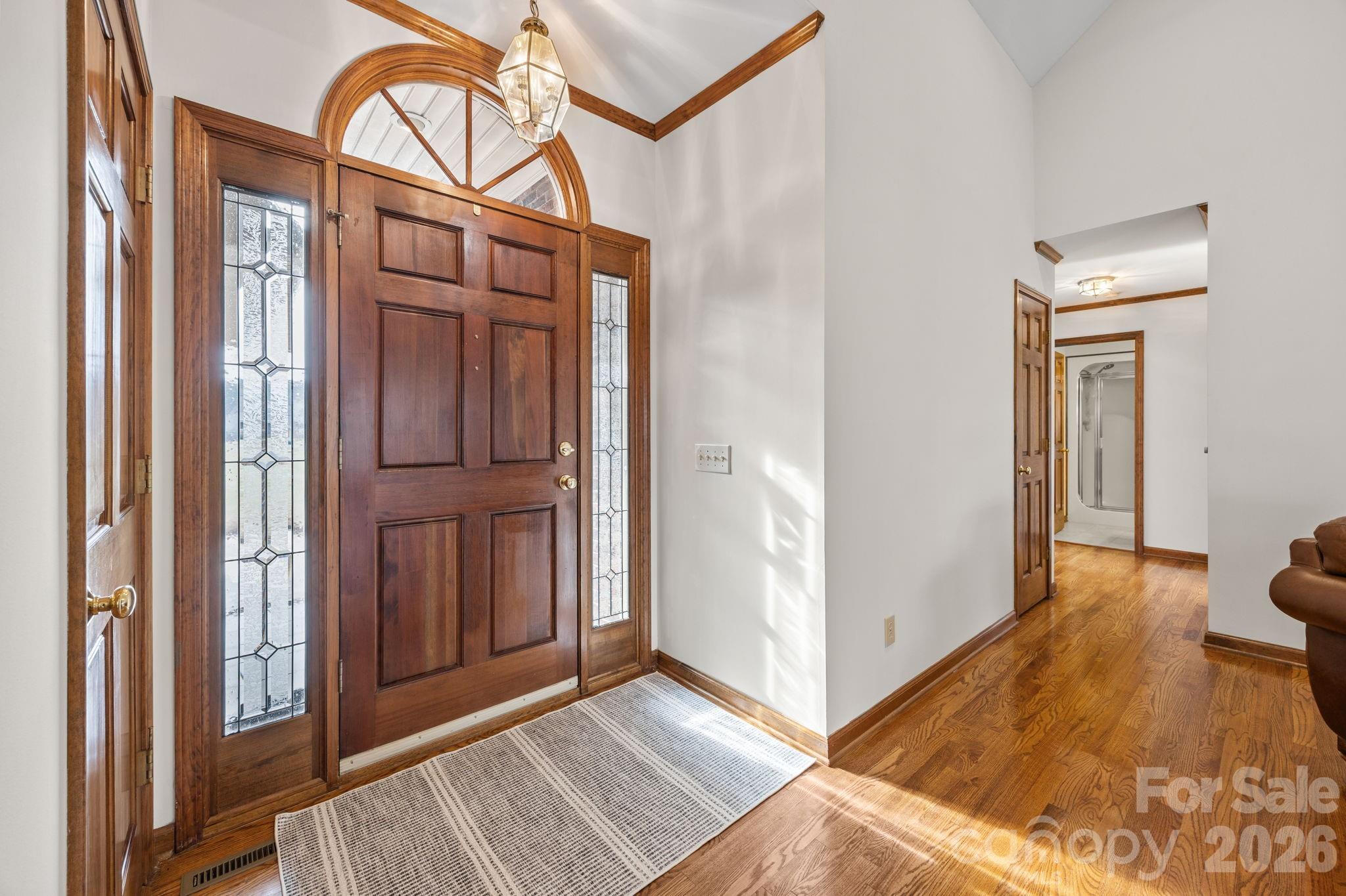 49449 River Run Road Albemarle, NC 28001 - Photo 4 of 45 a view of a hallway with wooden floor and cabinet