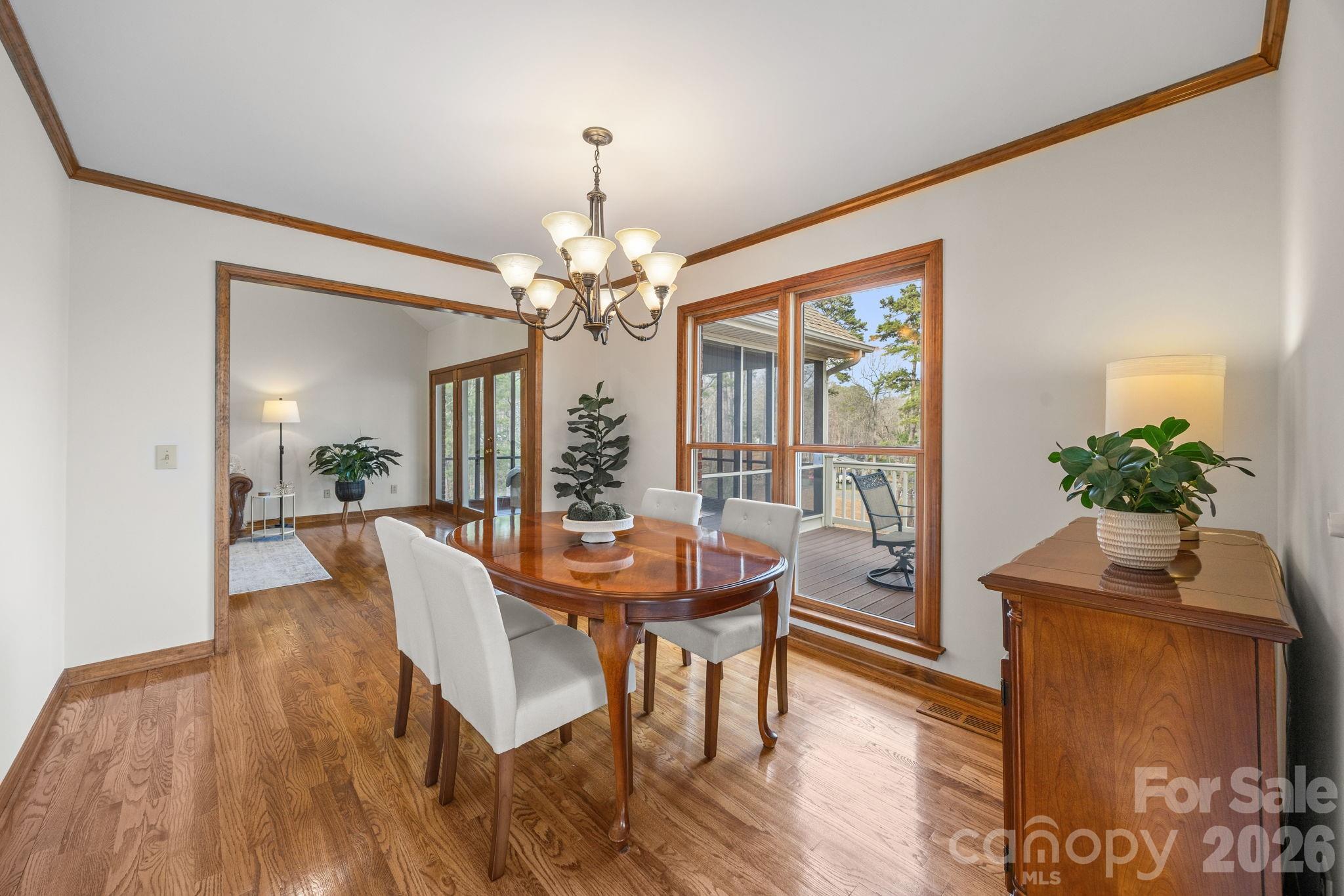 49449 River Run Road Albemarle, NC 28001 - Photo 8 of 45 a view of a dining room with furniture window and wooden floor