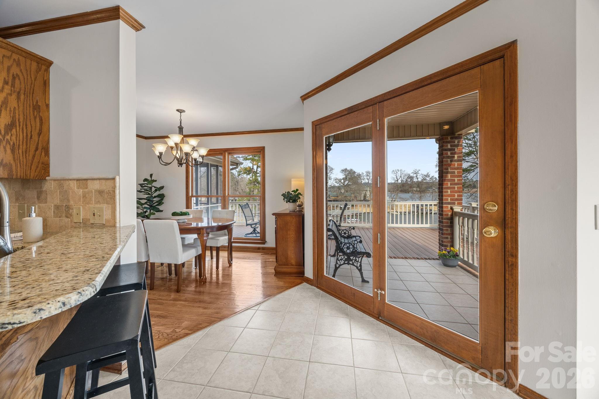 49449 River Run Road Albemarle, NC 28001 - Photo 9 of 45 a dining room with furniture and a floor to ceiling window