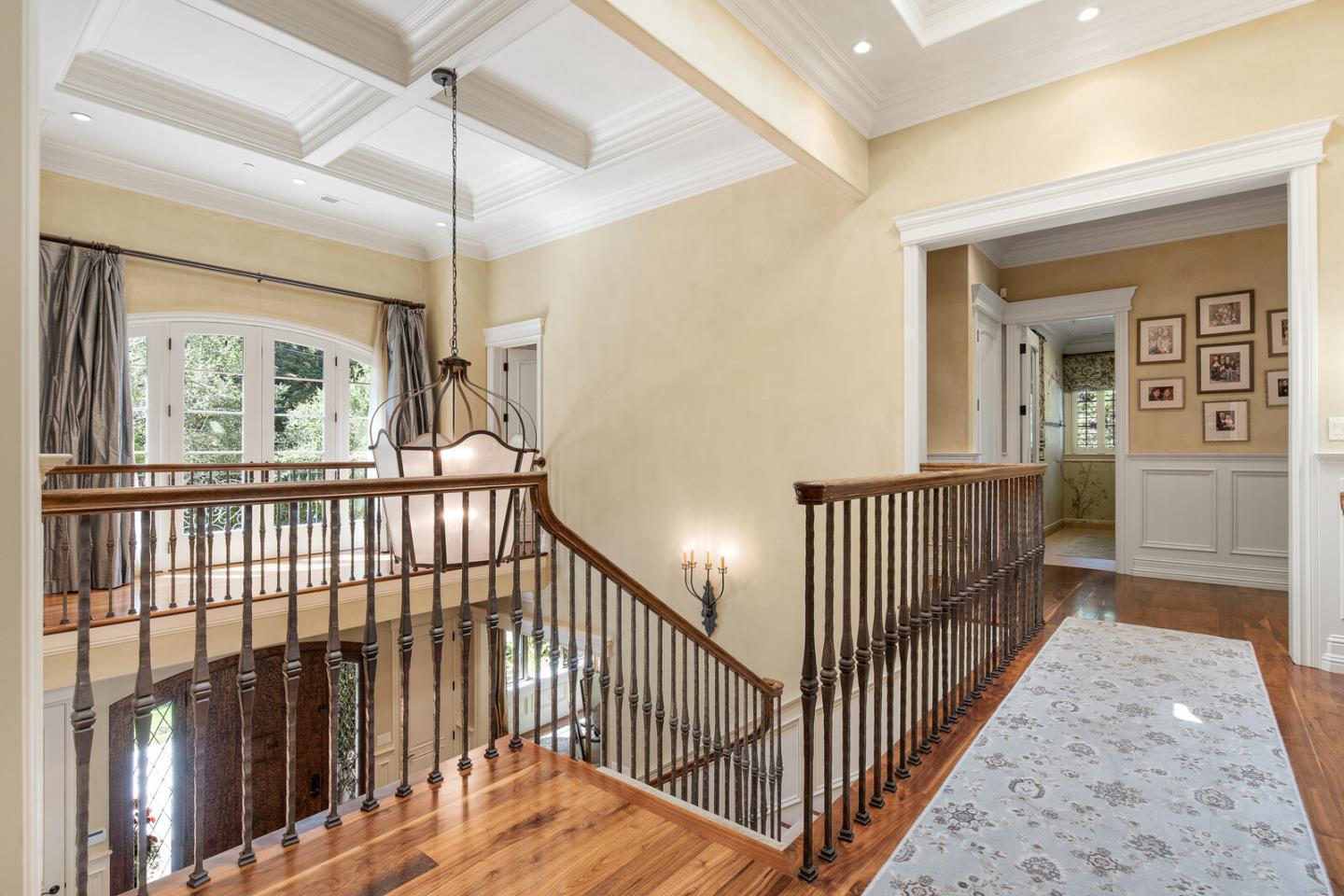 910 Link Road Hillsborough, CA 94010 - Photo 17 of 37 a view of a hallway with wooden floor and stairs