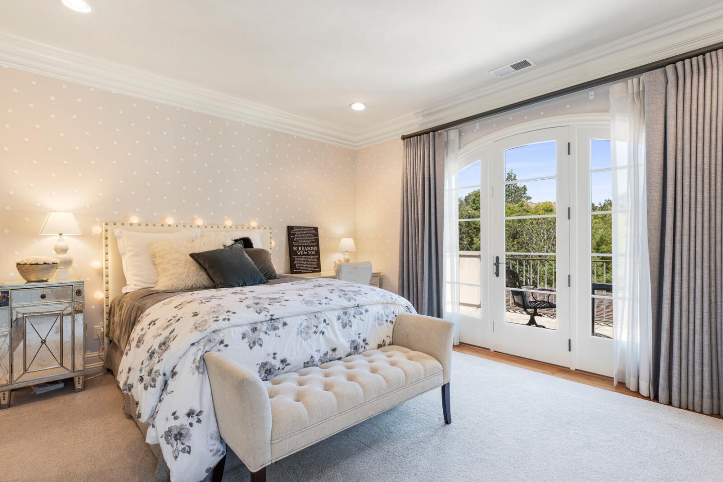 910 Link Road Hillsborough, CA 94010 - Photo 24 of 37 a spacious bedroom with a large bed and a large window