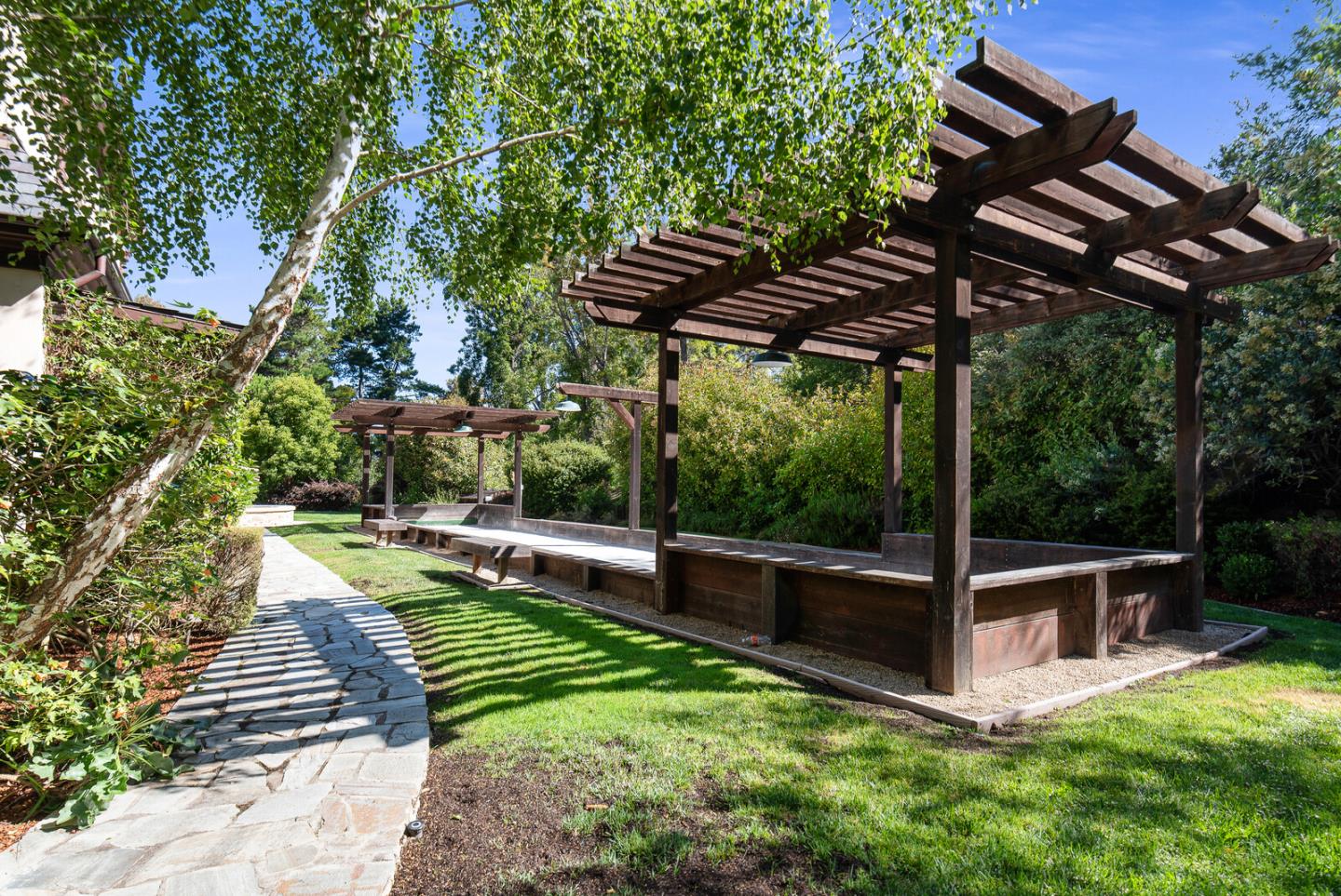 910 Link Road Hillsborough, CA 94010 - Photo 32 of 37 a view of a swimming pool with a patio