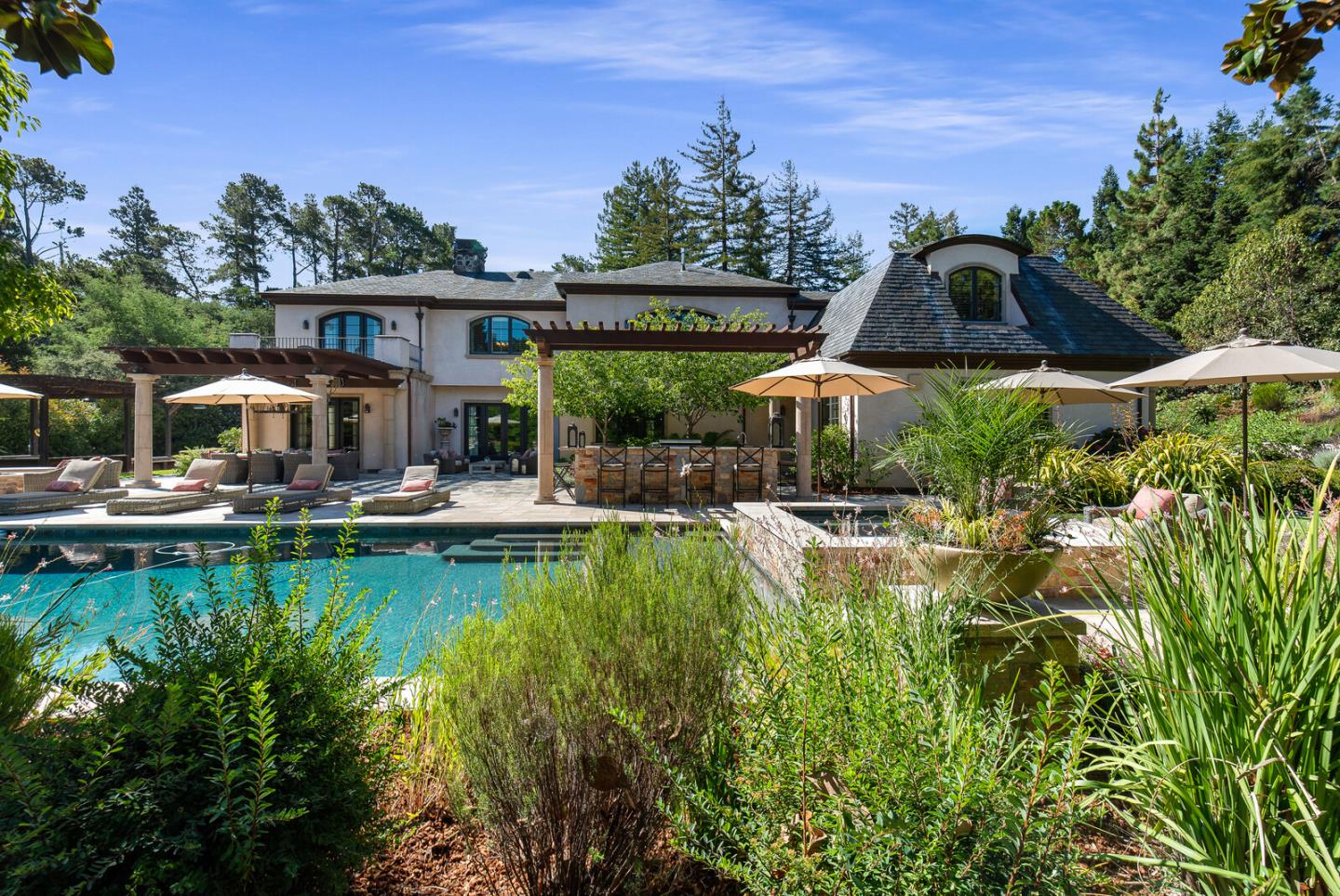 910 Link Road Hillsborough, CA 94010 - Photo 33 of 37 a front view of a house with swimming pool garden and patio