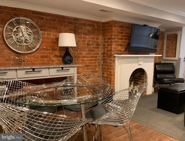 a view of a livingroom with furniture and a fireplace