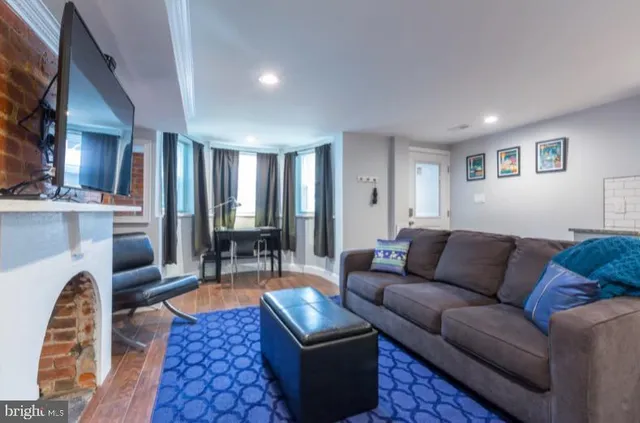 a living room with furniture and a table