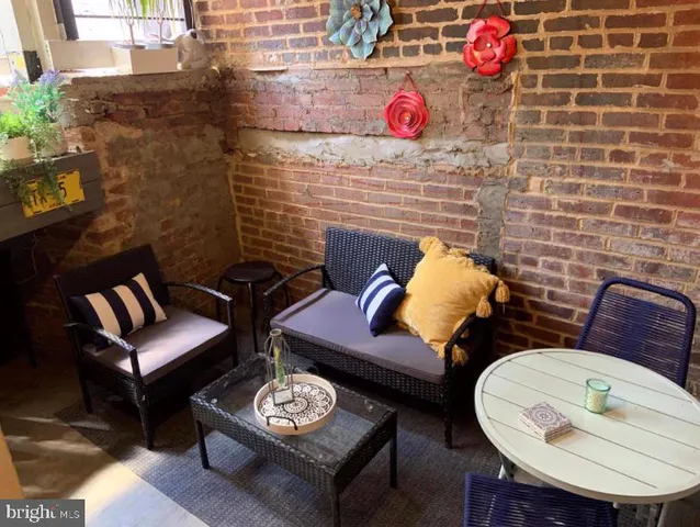 a view of a workspace with furniture