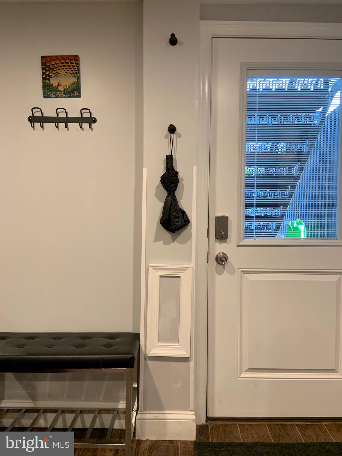 10 N Street Northwest, Unit STREET Washington, DC 20001 - Photo 10 of 11 a view of hallway with wooden floor and cabinet