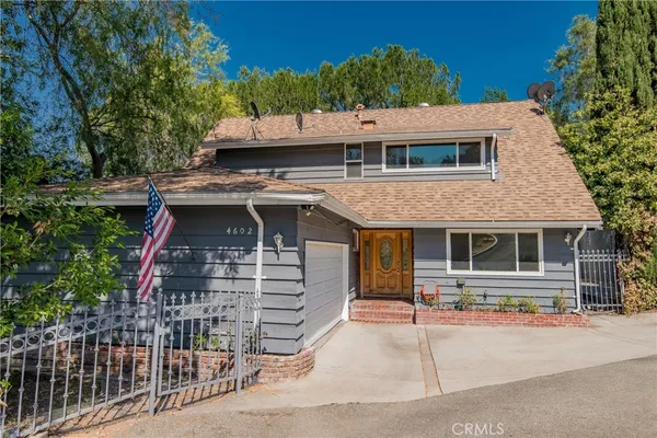 a front view of a house with a garage