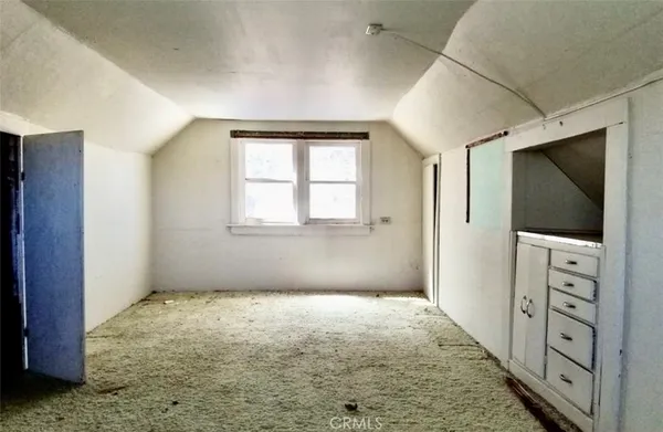 a big room with windows and closet