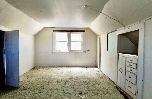 a big room with windows and closet