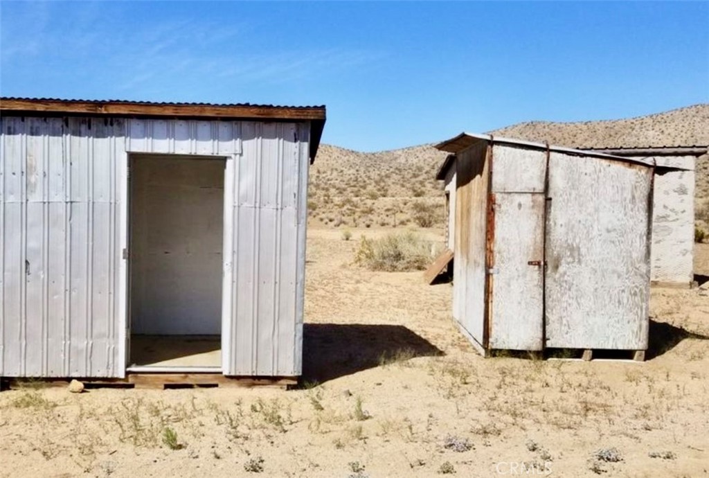 5151 Highway 395 Ridgecrest, CA 93555 - Photo 4 of 13 a view of a wooden door in front of a house