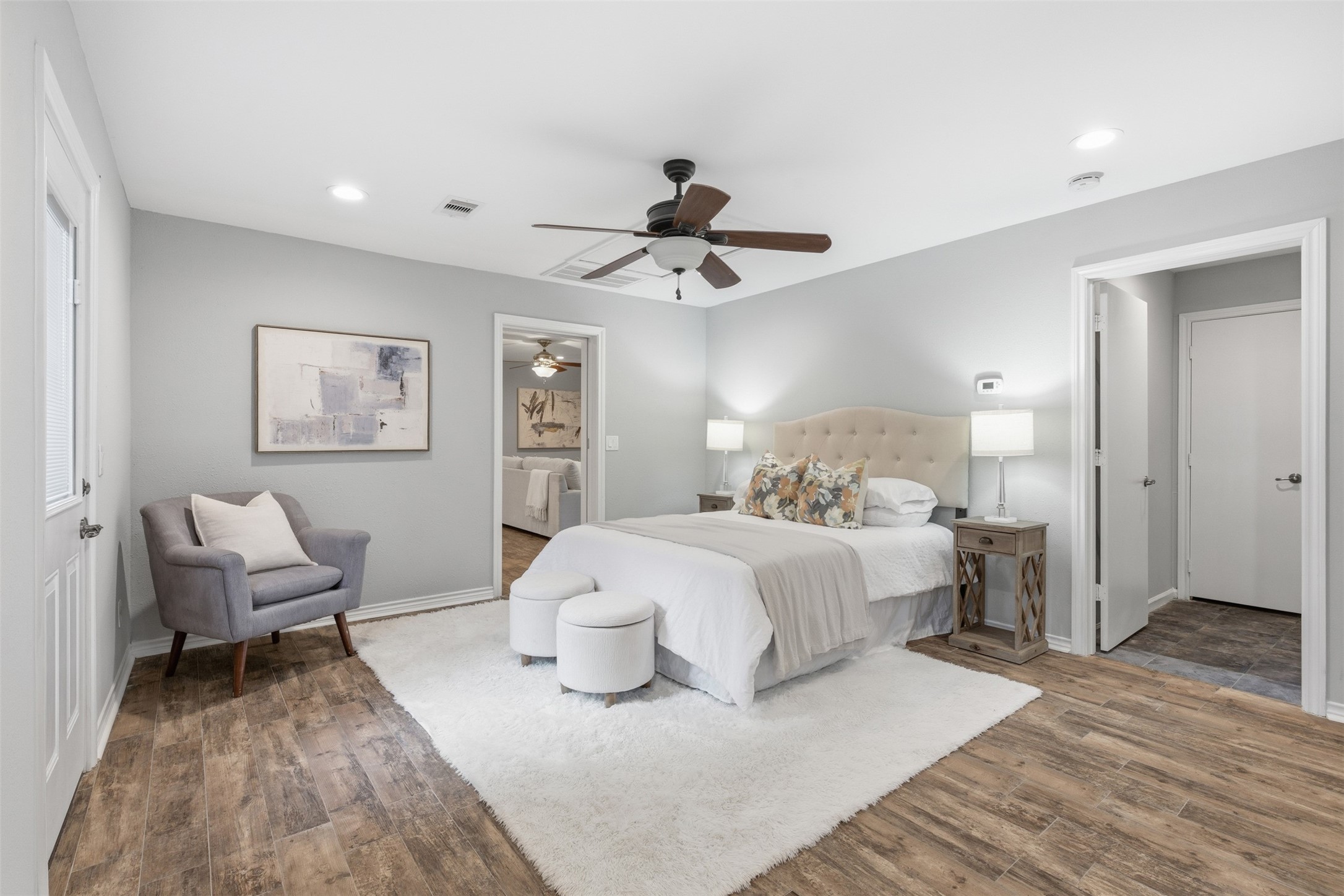 8107 Twining Oaks Lane Spring, TX 77379 - Photo 18 of 41 a bedroom with a bed and a chandelier