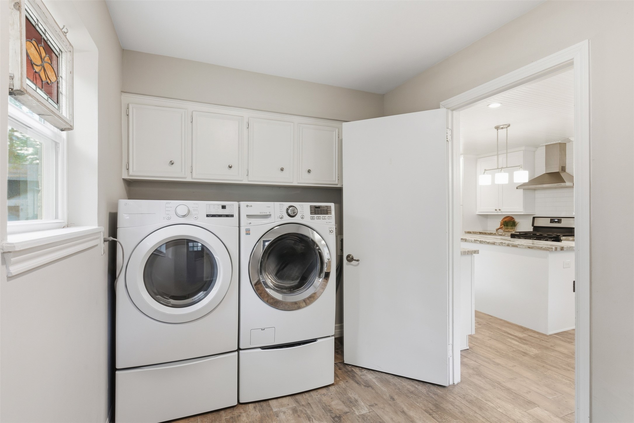 8107 Twining Oaks Lane Spring, TX 77379 - Photo 29 of 41 a utility room with sink dryer and washer