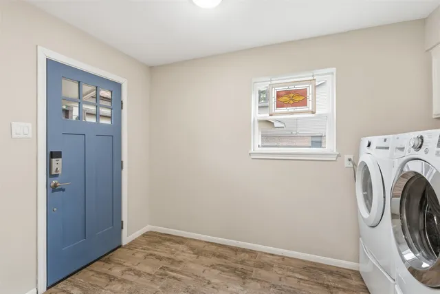a view of a hallway with washer and dryer