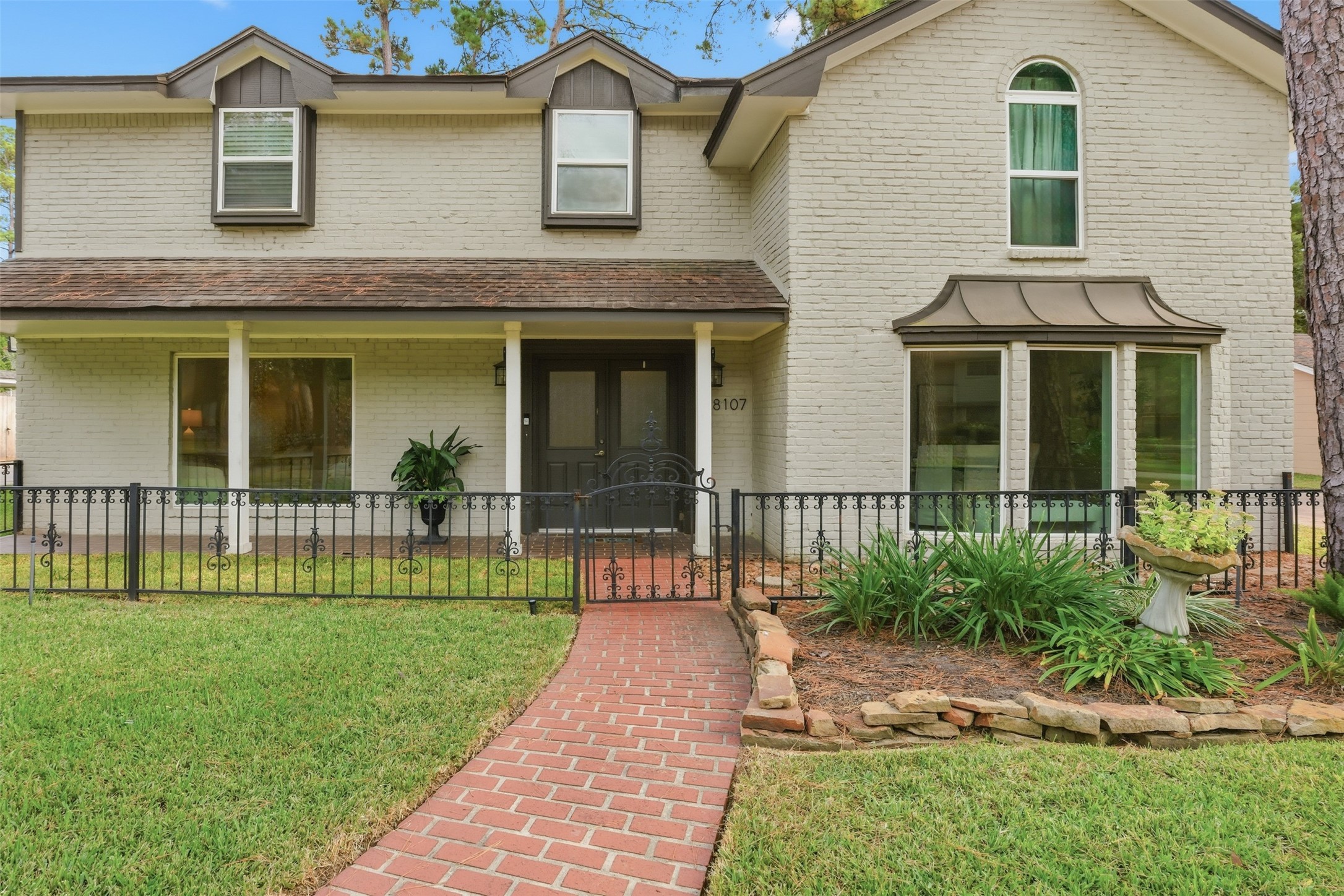 8107 Twining Oaks Lane Spring, TX 77379 - Photo 3 of 41 front view of a house with a yard