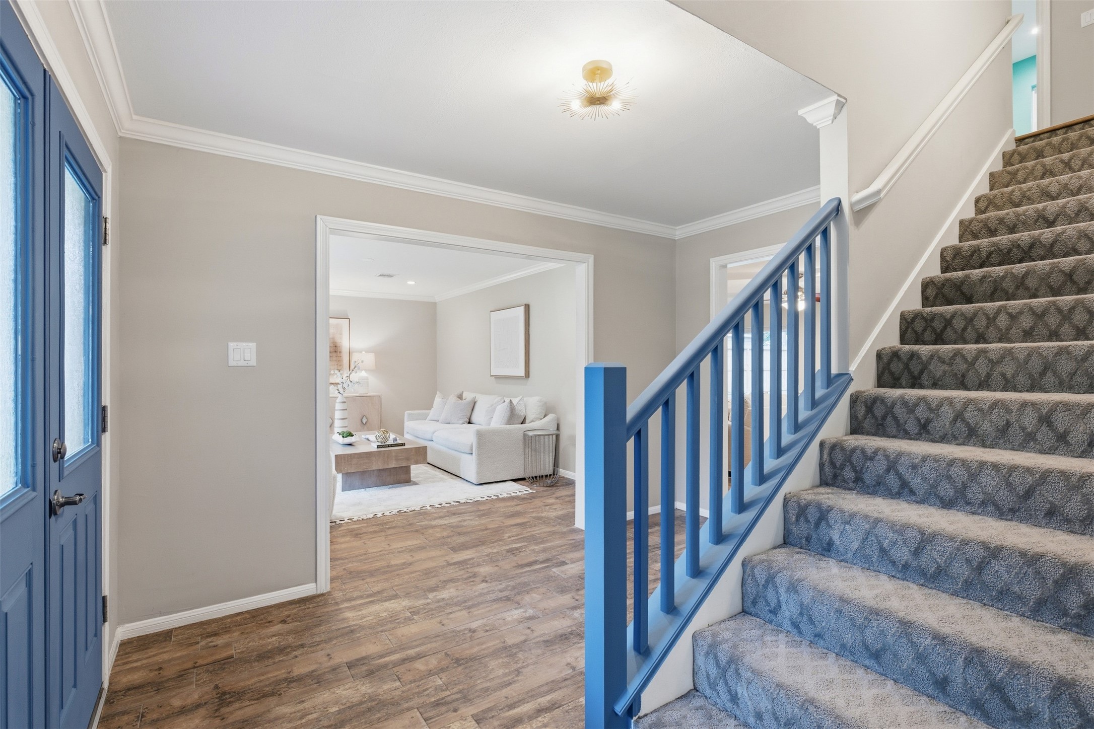 8107 Twining Oaks Lane Spring, TX 77379 - Photo 4 of 41 a view of a hallway with wooden floor and stairs
